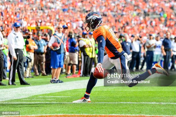 Wide receiver Emmanuel Sanders of the Denver Broncos has a six yard touchdown reception in the second quarter of a game against the Dallas Cowboys at...
