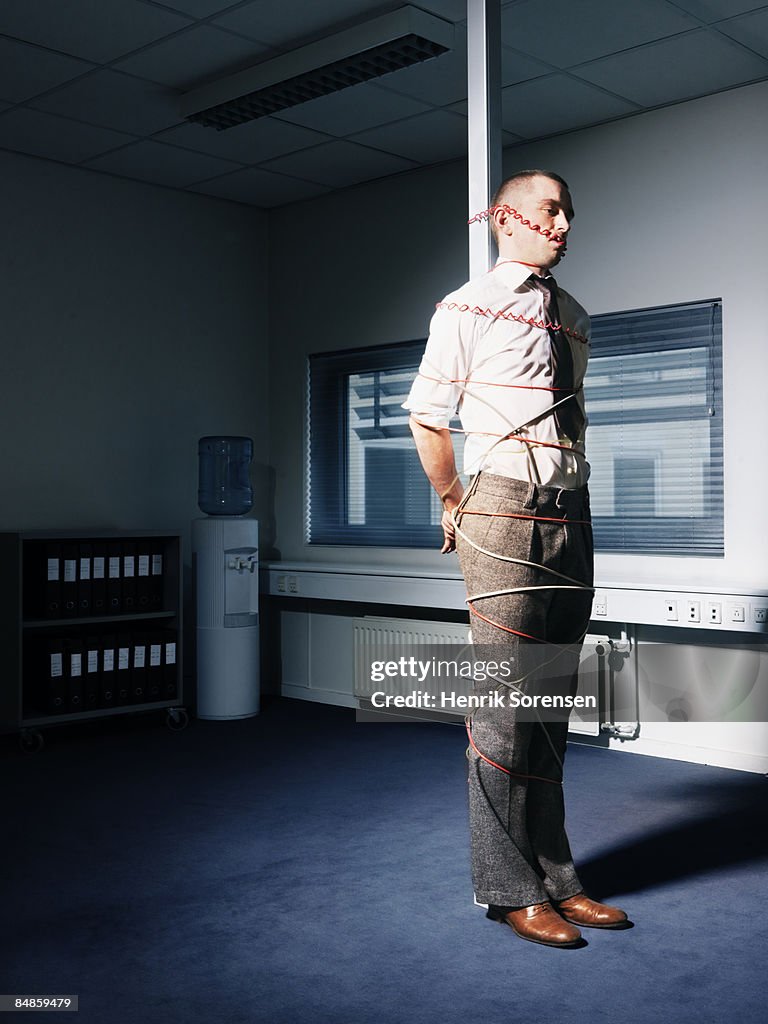 Man tied up in his office.