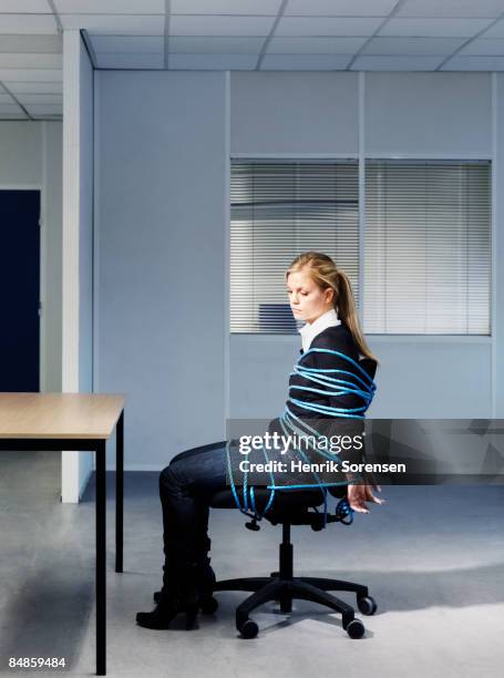 woman tied to her office chair. - tangled ストックフォトと画像