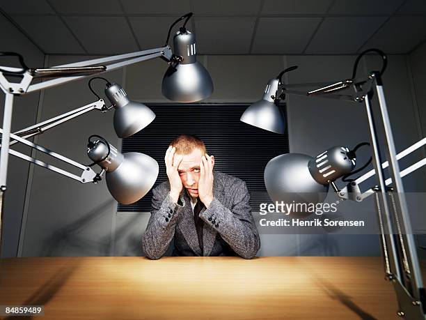 man being interrogated. - interrogation stock pictures, royalty-free photos & images