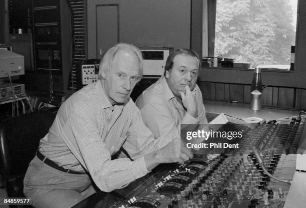Photo of George MARTIN and Geoff EMERICK, George Martin and Geoff Emerick - posed at mixing desk in Abbey Road Studios