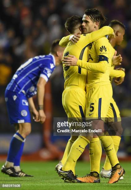 Nahitan Nandez of Boca Juniors celebrates with teammate Fernando Gago after scoring the fourth goal of his team during a match between Boca Juniors...