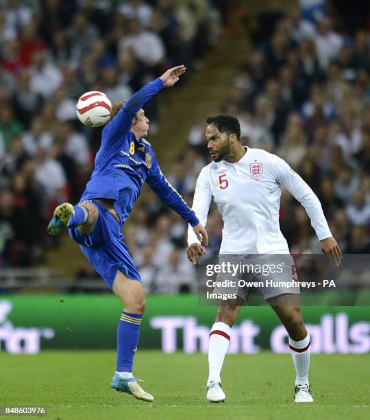 England's Joleon Lescott and Ukraine's Roman Zozulya battle for the ball