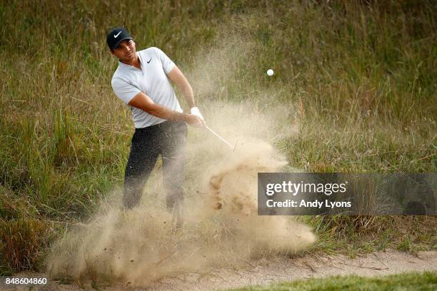 Jason Day of Australia hits his third shot on the 14th hole during the final round of the BMW Championship at Conway Farms Golf Club on September 17,...