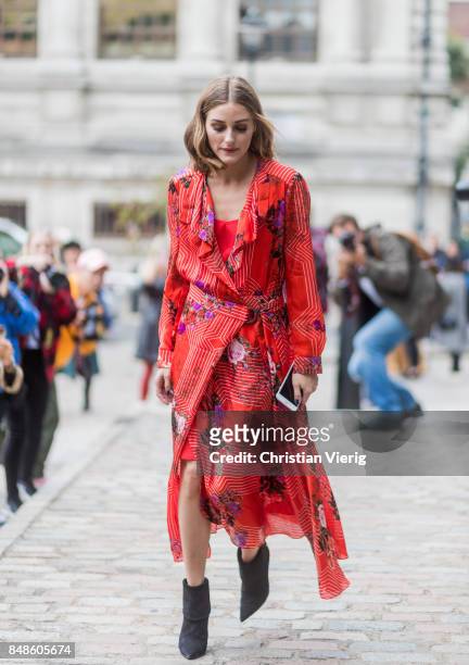 Olivia Palermo wearing red dress outside Preen during London Fashion Week September 2017 on September 17, 2017 in London, England.