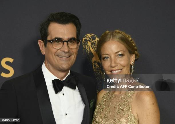 Ty Burrell and Holly Burrell arrive for the 69th Emmy Awards at the Microsoft Theatre on September 17, 2017 in Los Angeles, California. / AFP PHOTO /...