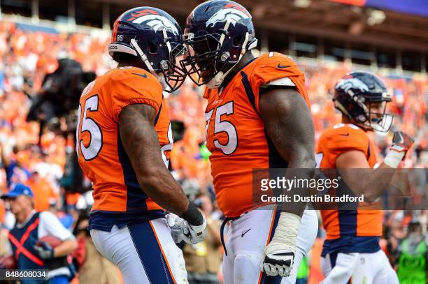 Tight end Virgil Green of the Denver Broncos celebrates with Menelik Watson after a third quarter touchdown against the Dallas Cowboys at Sports...