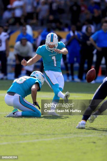 Matt Haack holds while Cody Parkey of the Miami Dolphins kicks a 54 yard field goal during the second half of a game against the Los Angeles Chargers...