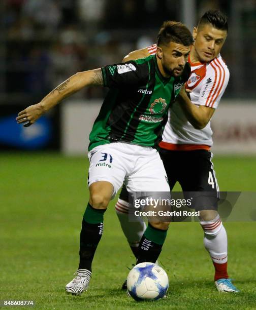 Nicolas Mana of San Martin fights for the ball with Jorge Luis Moreira of River Plate during a match between San Martin de San Juan and River Plate...