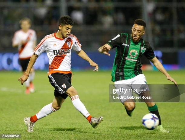 Exequiel Palacios of River Plate fights for the ball with Claudio Mosca of San Martin during a match between San Martin de San Juan and River Plate...