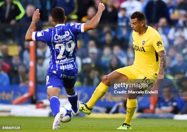 Edwin Cardona of Boca Juniors fights for the ball with Luciano Abecasis of Godoy Cruz during a match between Boca Juniors and Godoy Cruz as part of...