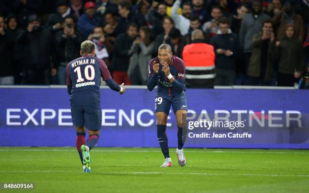 Kylian Mbappe of PSG celebrates his goal with Neymar Jr during the French Ligue 1 match between Paris Saint Germain and Olympique Lyonnais at Parc...