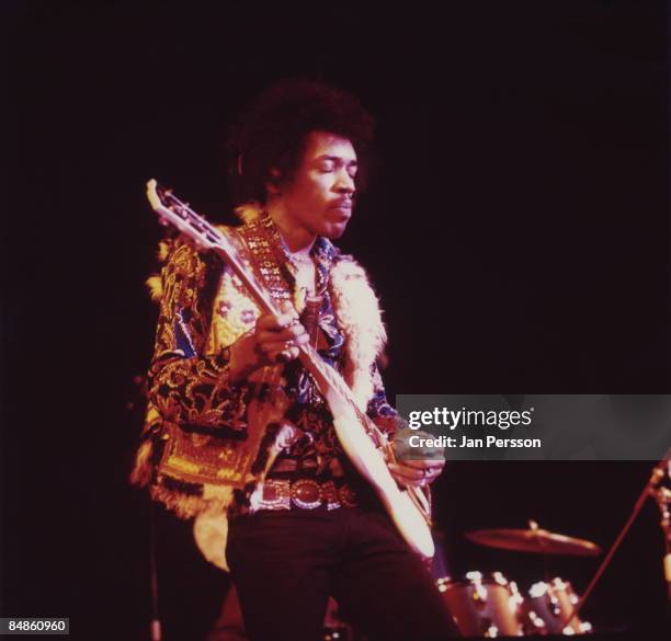 Photo of Jimi HENDRIX; performing live onstage at Falkoner Centret, playing Gibson SG guitar