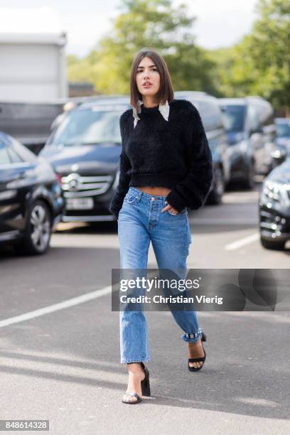 Patricia Manfield wearing black sweater, denim jeans outside Versus Versace during London Fashion Week September 2017 on September 17, 2017 in...