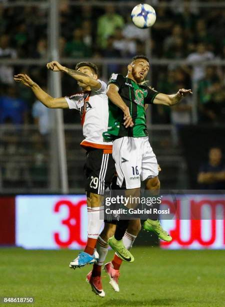 Gonzalo Montiel of River Plate fights for the ball with Claudio Mosca of San Martin during a match between San Martin de San Juan and River Plate as...