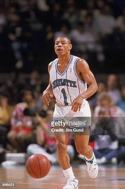 Mugsy Bogues of the Charlotte Hornets dribbles the ball during an NBA game at Charlotte Colesium in 1989.