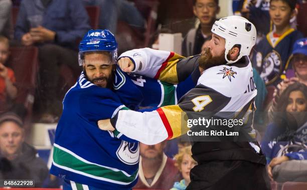 Clayton Stoner of the Vegas Golden Knights lands a right hand during a fight with Darren Archibald of the Vancouver Canucks in NHL pre-season action...