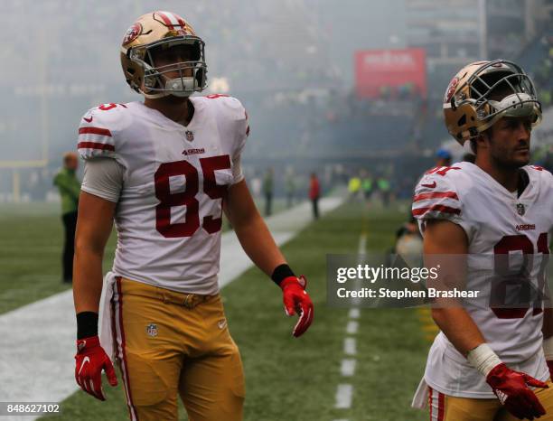 Tight end George Kittle of the San Francisco 49ers and wide receiver Trent Taylor walk off the field after the game against the Seattle Seahawks at...