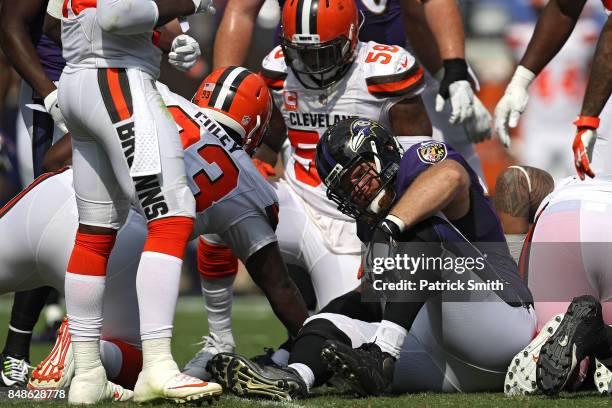Offensive guard Marshal Yanda of the Baltimore Ravens holds in ankle before exiting the game with an injury against the Cleveland Browns at M&T Bank...