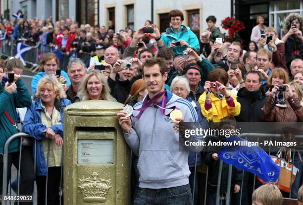 Olympic and US Open champion Andy Murray standing next to his gold painted post box during a walkabout in Dunblane, near Stirling in Scotland, on his...