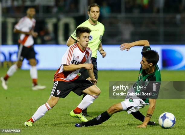 Matias Moya of River Plate fights for the ball with Alvaro Fernandez of San Martin during a match between San Martin de San Juan and River Plate as...