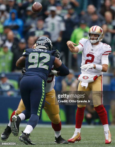 Quarterback Brian Hoyer of the San Francisco 49ers passes downfield over defensive tackle Nazair Jones of the Seattle Seahawks during the third...