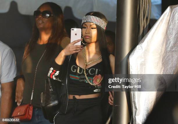 Nicki Minaj attends as Nas performs onstage during Day 3 at The Meadows Music & Arts Festival at Citi Field on September 17, 2017 in New York City.