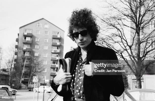 Photo of Bob DYLAN; posed, wearing sunglasses, looking to camera