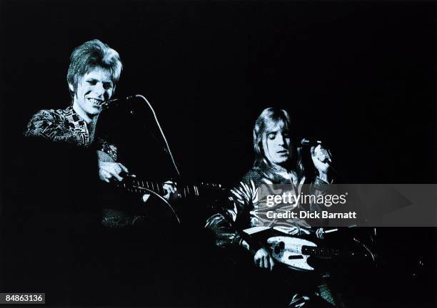 Photo of David BOWIE and Mick RONSON; David Bowie and Mick Ronson performing on stage - Wallington Public Hall, Surrey, on first Ziggy Stardust tour
