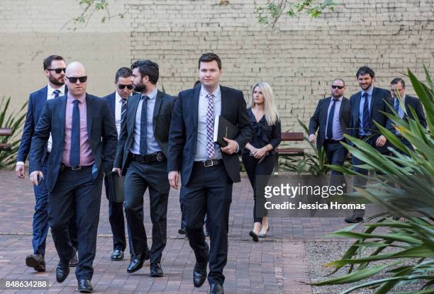 An entourage of mostly AFP representatives arrive at Sydney Central Local Court for the hearing of Michael and Fadi Ibrahim, Mustapha Dib and Koder...