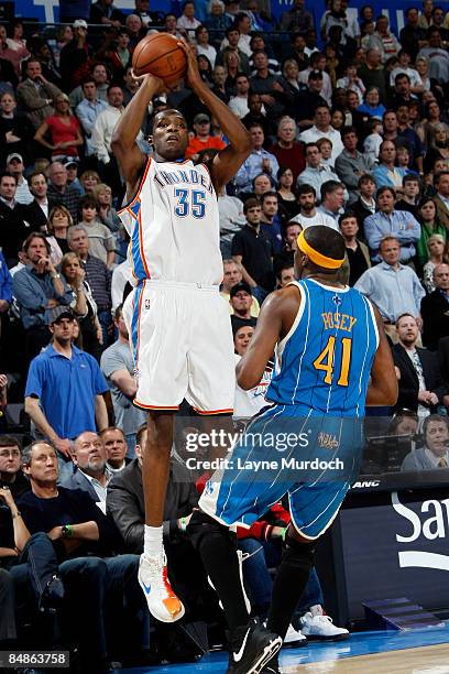 Kevin Durant of the Oklahoma City Thunder shoots a 3-pointer over James Posey of the New Orleans Hornets to tie the game with 13.8 seconds on...