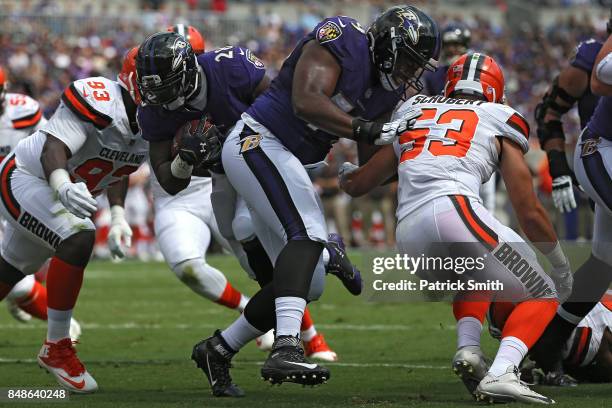 Running back Terrance West of the Baltimore Ravens scores a touchdown during the first quarter against the Cleveland Browns at M&T Bank Stadium on...