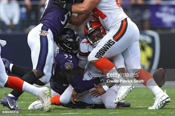Outside linebacker Terrell Suggs of the Baltimore Ravens forces a fumble as he tackles quarterback DeShone Kizer of the Cleveland Browns during the...