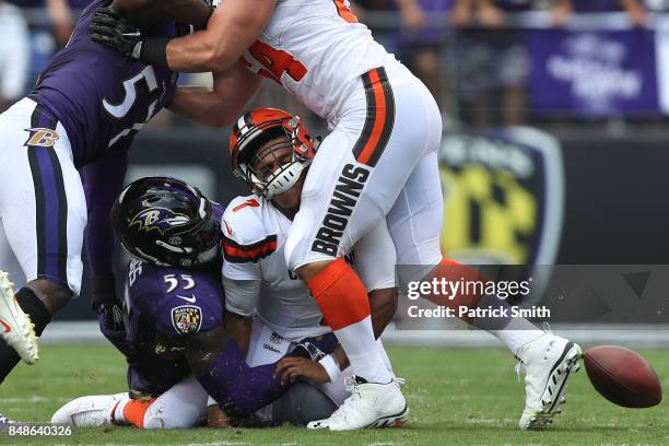 Outside linebacker Terrell Suggs of the Baltimore Ravens forces a fumble as he tackles quarterback DeShone Kizer of the Cleveland Browns during the...