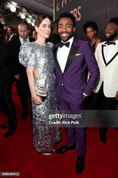 Actors Sarah Paulson and Donald Glover walk the red carpet during the 69th Annual Primetime Emmy Awards at Microsoft Theater on September 17, 2017 in...