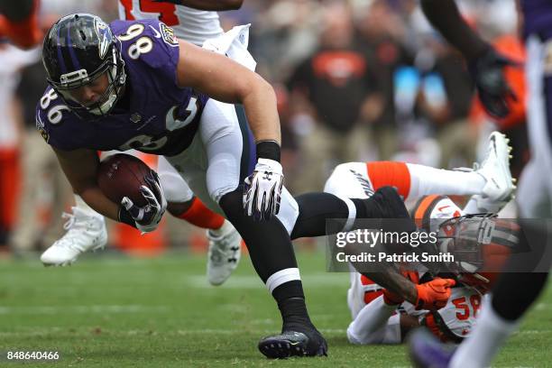 Tight end Nick Boyle of the Baltimore Ravens rushes past outside linebacker Christian Kirksey of the Cleveland Browns during the first half at M&T...