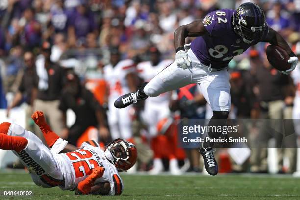 Tight end Benjamin Watson of the Baltimore Ravens eludes free safety Jabrill Peppers of the Cleveland Browns as he rushes up the field during the...