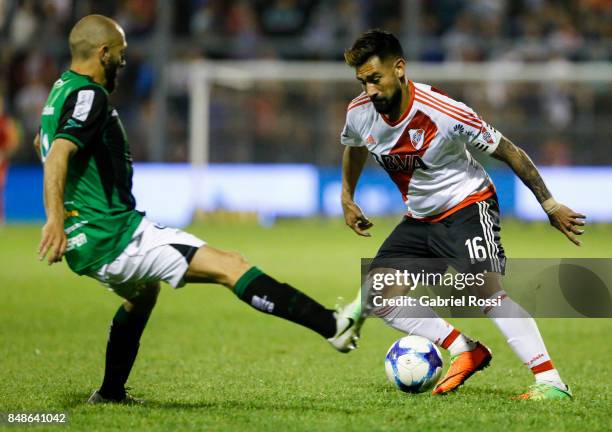 Ariel Rojas of River Plate fights for the ball with Gonzalo Prosperi of San Martin during a match between San Martin de San Juan and River Plate as...