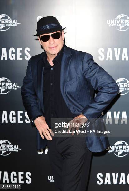John Travolta attending a photocall for new film Savages at the Mandarin Hotel, London.