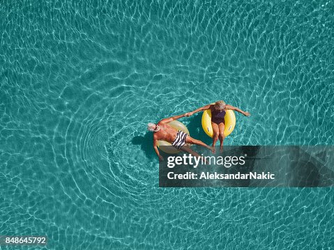 Senior couple enjoy sea water Senior couple enjoy sea water