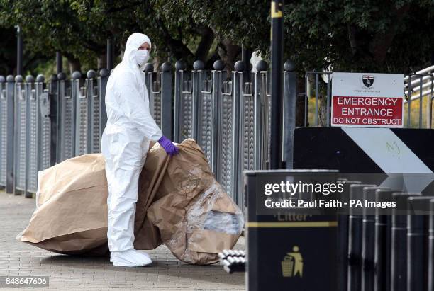 Forensic officer at the scene outside the main council offices, beside the River Foyle, in Londonderry, after dissident republicans attached a bomb...