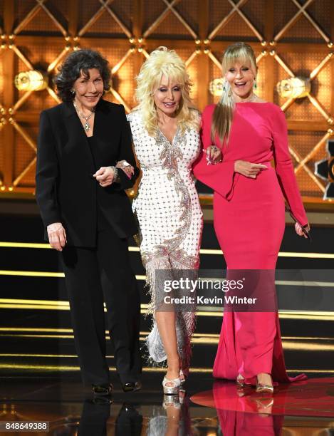 Actors Lily Tomlin, Dolly Parton and Jane Fonda walk onstage during the 69th Annual Primetime Emmy Awards at Microsoft Theater on September 17, 2017...