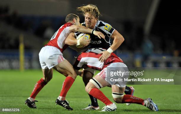 Sale Sharks Andy Powell is tackled by London Welsh's Gordon Ross and Michael Hills during the Aviva Premiership match at Salford City Stadium,...