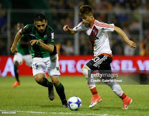 Alan Marcel of River Plate fights for the ball with Adrian Pucheta of San Martin during a match between San Martin de San Juan and River Plate as...
