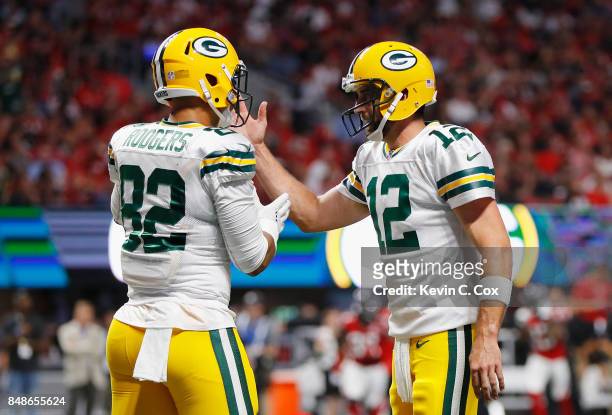 Richard Rodgers and Aaron Rodgers of the Green Bay Packers celebrate after a first quarter touchdown by Ty Montgomery against the Atlanta Falcons at...