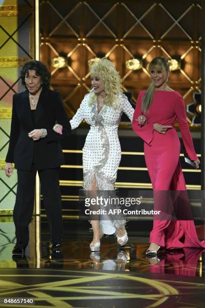 Lily Tomlin , Dolly Parton and Jane Fonda arrive onstage during the 69th Emmy Awards at the Microsoft Theatre on September 17, 2017 in Los Angeles,...