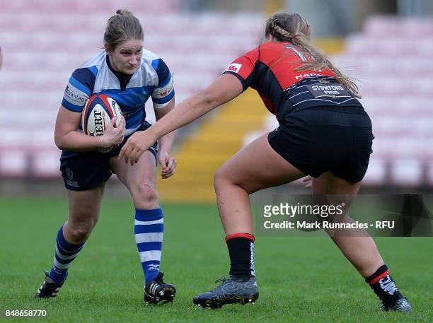Ruth Nash of Darlington Mowden Park Sharks is tackled by Molly Morrissey of Gloucester-Hartpury Women's RFC during the Womens Tyrrells Premier 15s...