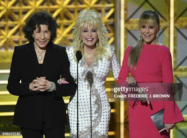 Lily Tomlin , Dolly Parton and Jane Fonda speak during the 69th Emmy Awards at the Microsoft Theatre on September 17, 2017 in Los Angeles, California.