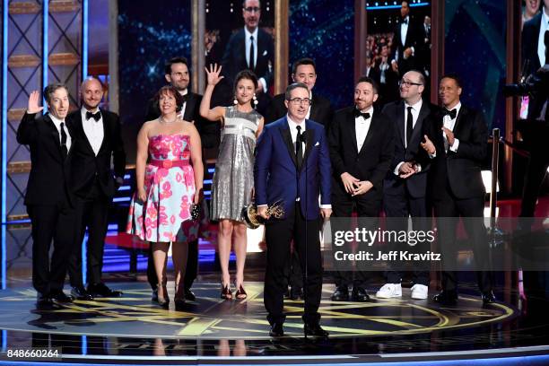 Writer/TV personality John Oliver and crew accept the Outstanding Writing for a Variety Series award for 'Last Week Tonight with John Oliver' onstage...
