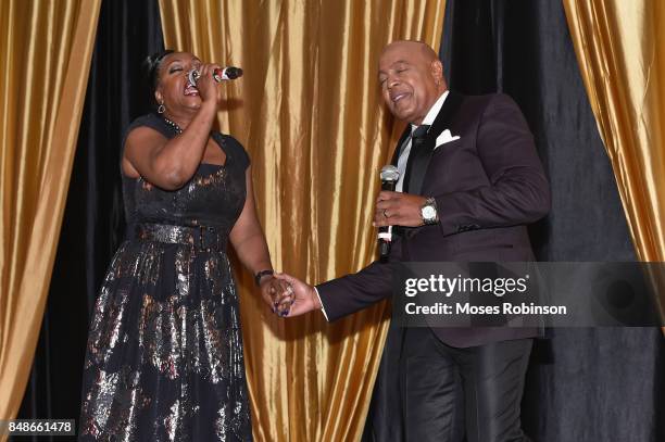 Recording artist Regina Belle and recording artist Peabo Bryson perform at the 2017 DMF Care for Congo Gala at St. Regis Hotel on September 16, 2017...